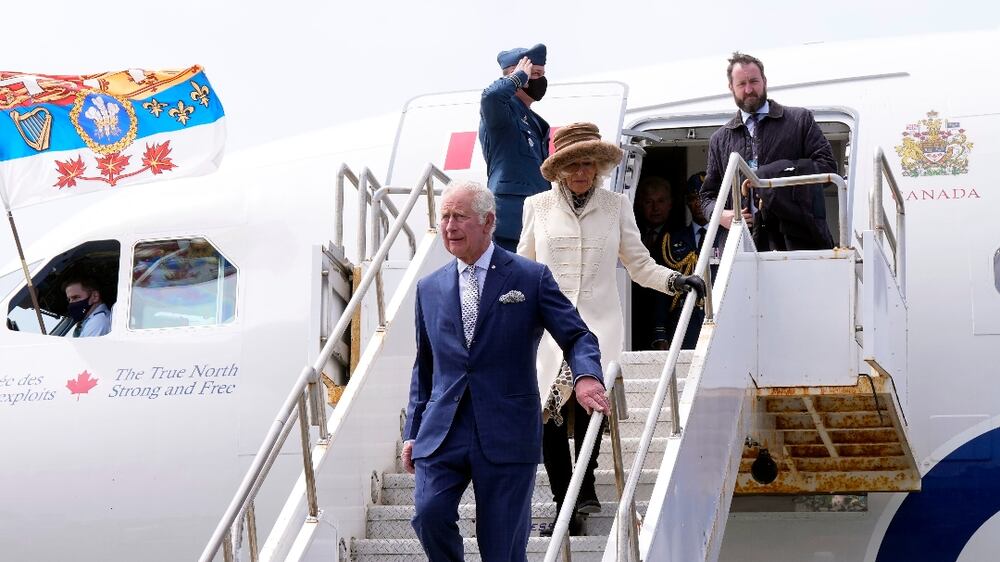 Prince Charles and Camilla, Duchess of Cornwall, arrive in St.  John's to begin a three-day Canadian tour, Tuesday, May 17, 2022.   (Paul Chiasson / The Canadian Press via AP)