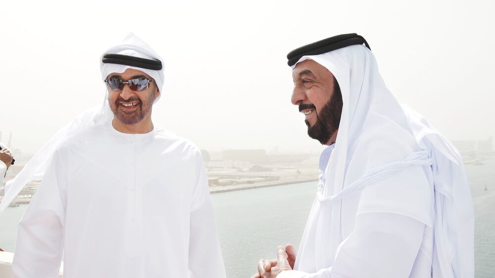 Abu Dhabi - August 4, 2009: HH General Sheikh Mohammed bin Zayed Al Nahyan, Crown Prince of Abu Dhabi, Deputy Supreme Commander of the Armed Forces and Chairman of the Executive Council of the Emirate of Abu Dhabi (left) and HH President Sheikh Khalifa bin Zayed Al Nahyan, President of the UAE share a light moment during an inspection at the Saadiyat Island Bridge. ( Philip Cheung / The National )