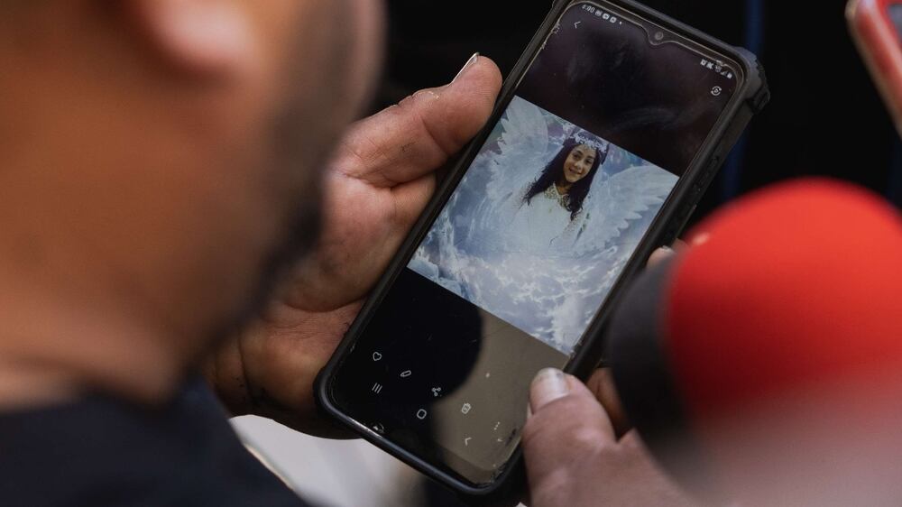 UVALDE, TX - MAY 25: Jacinto Cazares shows a photo of his daughter who was killed at Robb Elementary School, 10-year-old Jackie Cazares, to reporters following a press conference at Uvalde High School on May 25, 2022 in Uvalde, Texas.  On May 24, 21 people were killed, including 19 children, during a mass shooting at Robb Elementary School.  The shooter, identified as 18-year-old Salvador Ramos, was reportedly killed by law enforcement.    Jordan Vonderhaar / Getty Images / AFP
