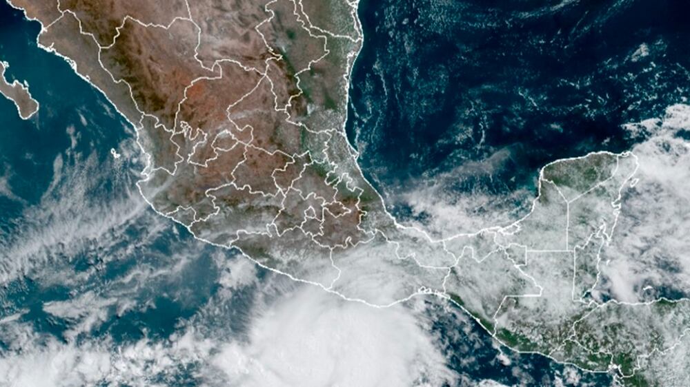 This satellite image made available by NOAA shows Hurricane Agatha, center, off the Pacific coast of Mexico on Sunday, May 29, 2022, at 11:20 a. m.  EDT.  (NOAA via AP)