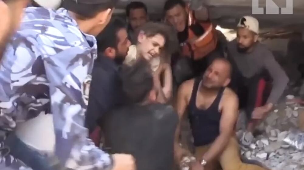 Gaza girl pulled out alive from rubble after Israeli air strike