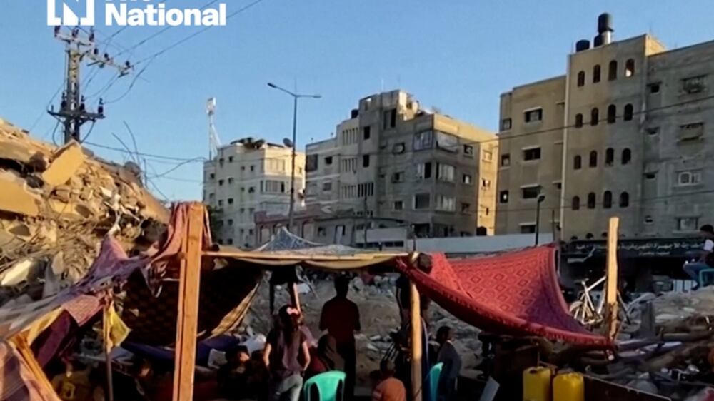 Gazans camp in tents in rubble of their former homes