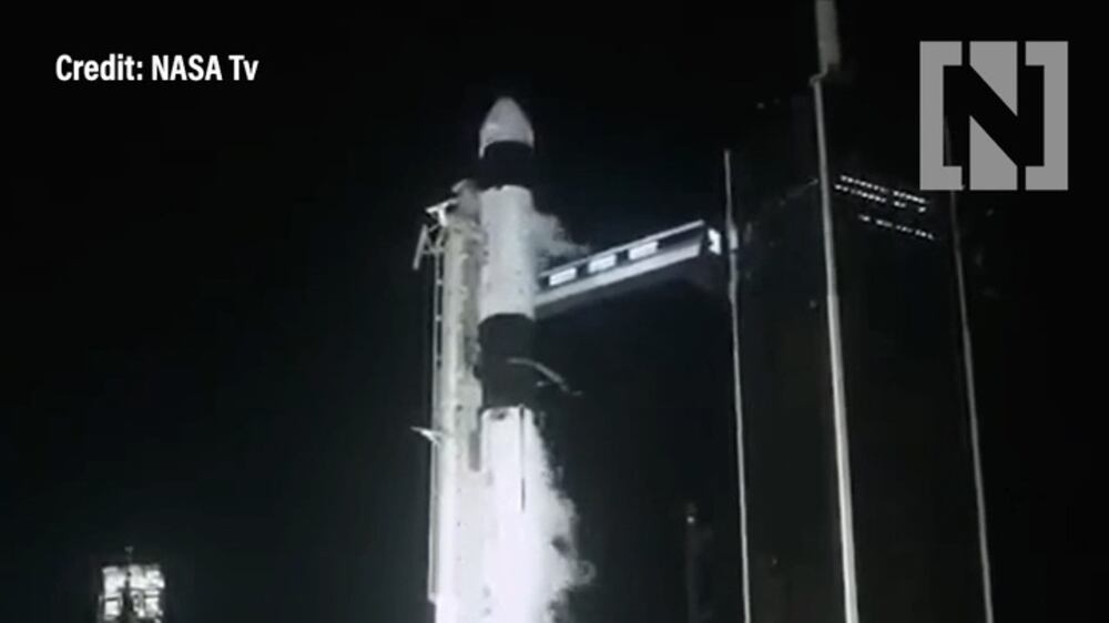 Astronauts launched into orbit using recycled SpaceX rocket and capsule