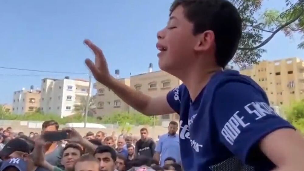 Heartbroken Palestinian boy follows his father's funeral