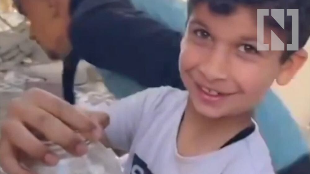 Children in Gaza rescue fish from rubble