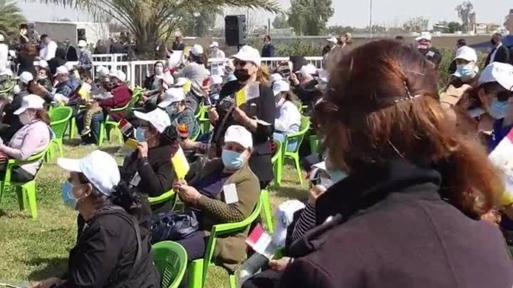 Crowds line the streets outside Baghdad airport awaiting the Pope