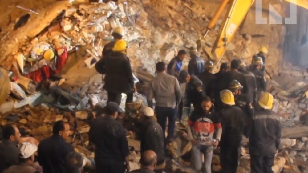 Apartment building collapses in Alexandria