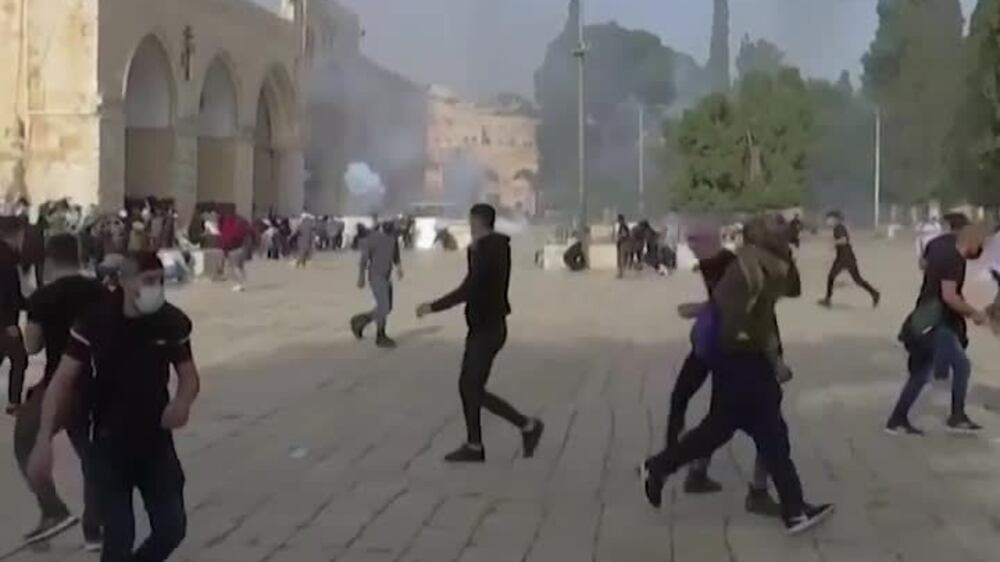 Israeli police storm Al Aqsa compound and fire on worshippers