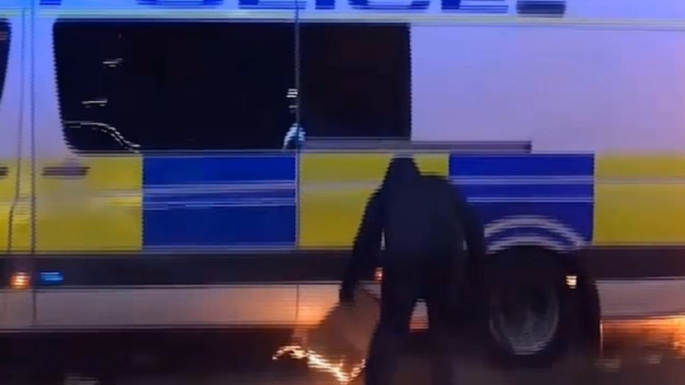 Police release footage of man placing burning item under officer's van during Bristol riots