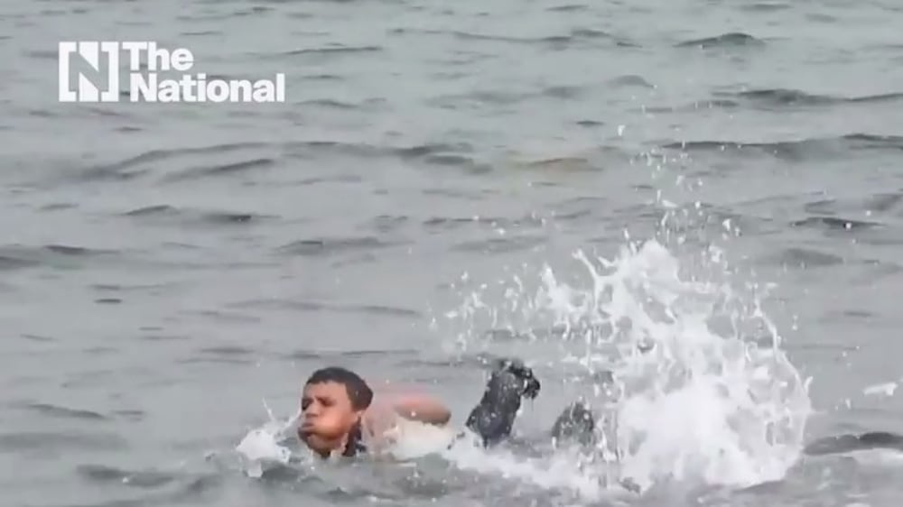 Migrant boy swims to Spain's Ceuta with plastic bottles to stay afloat