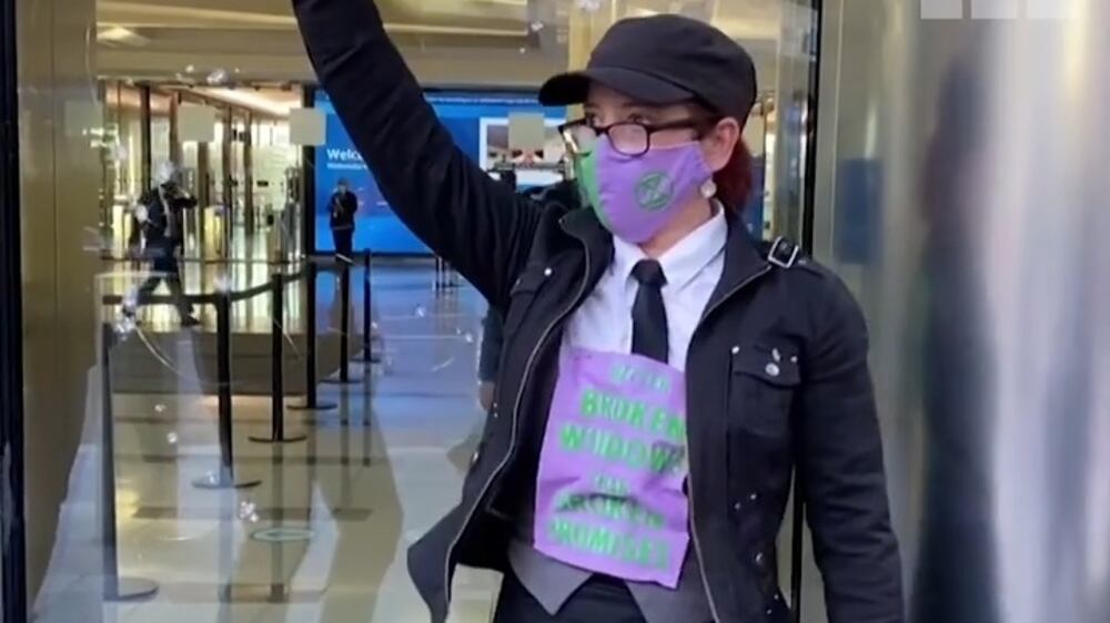 Extinction Rebellion protesters smash Barclays' London HQ windows