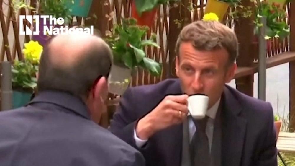 French President Emmanuel Macron sips coffee at cafe as French bars and restaurants reopen