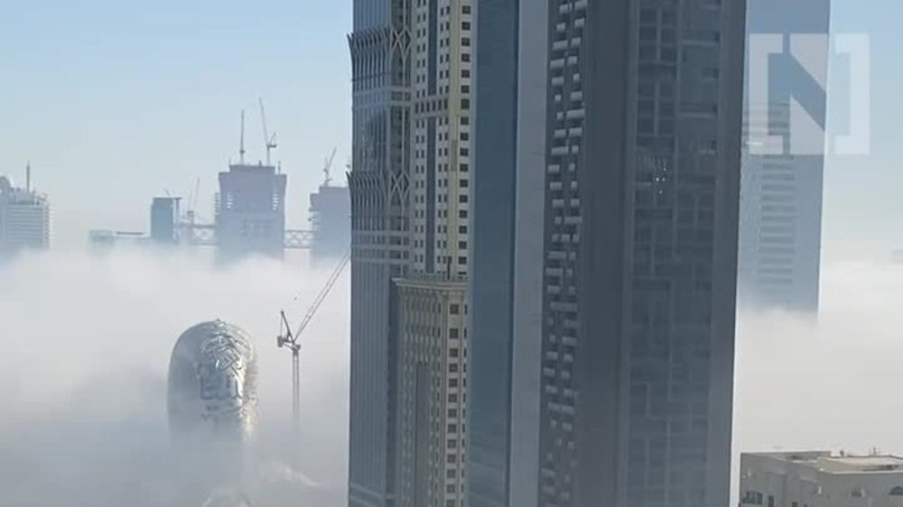Thick fog snakes around Dubai skyscrapers