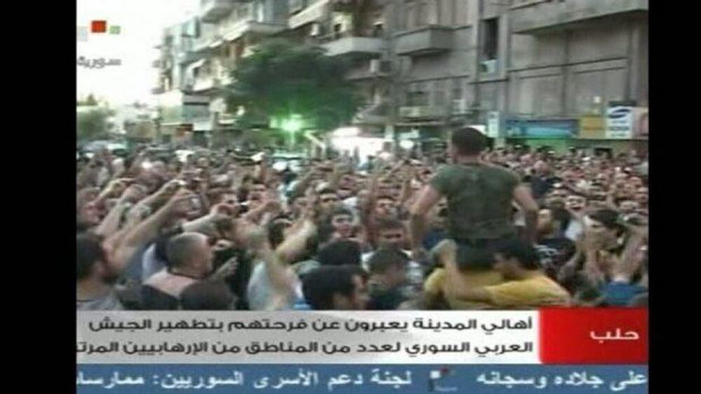 Video: Assad supporters rally in Aleppo