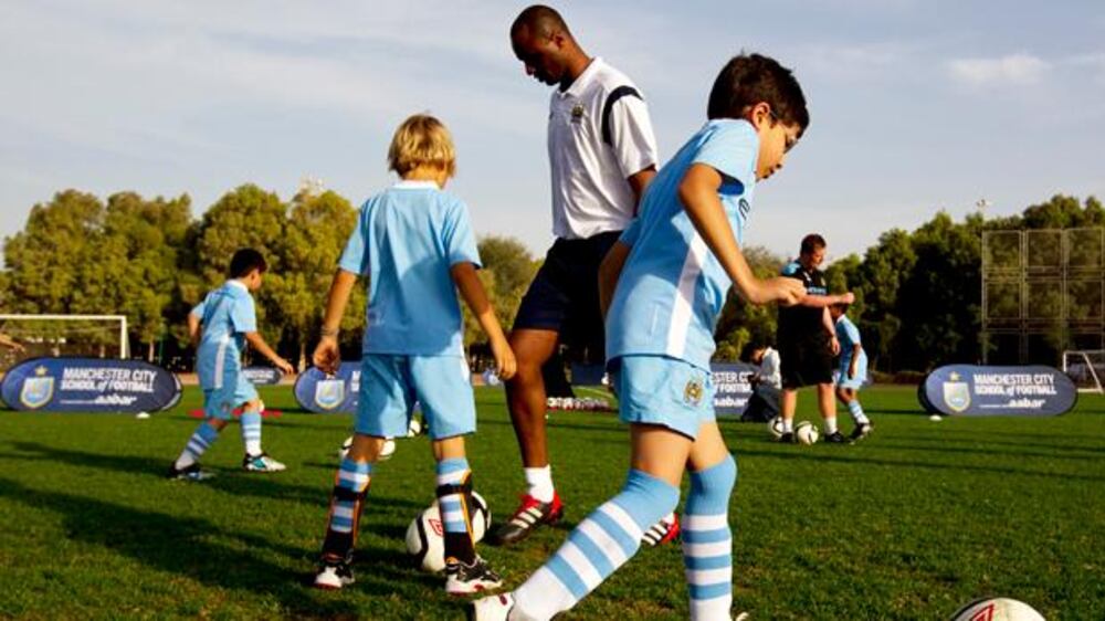 Patrick Vieira coaches children at Manchester City School of Football