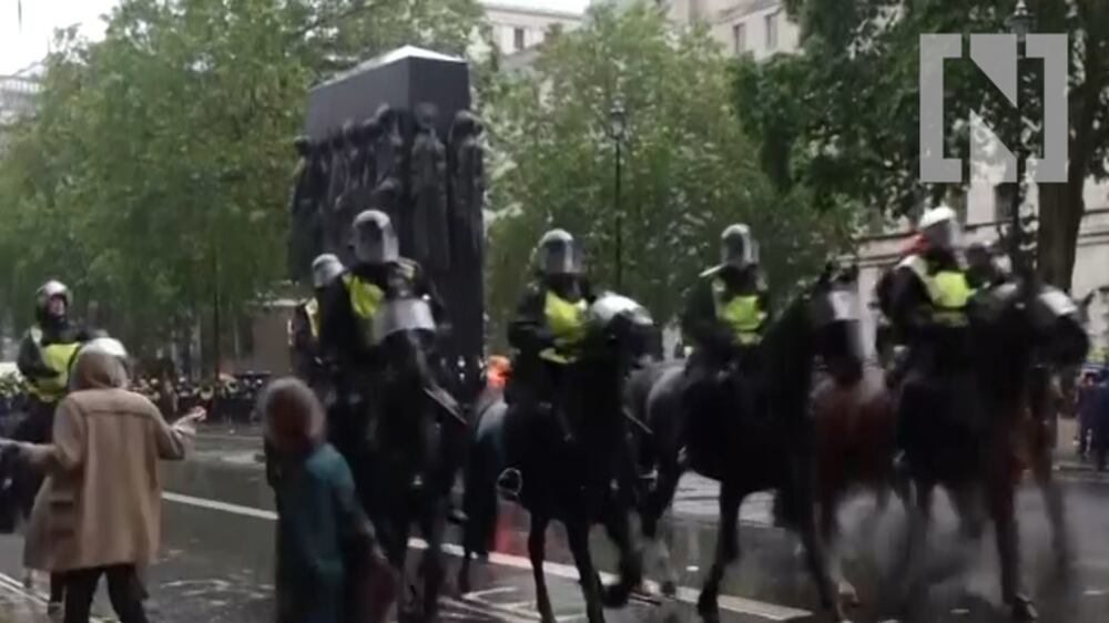 Mounted police clash with protesters in London
