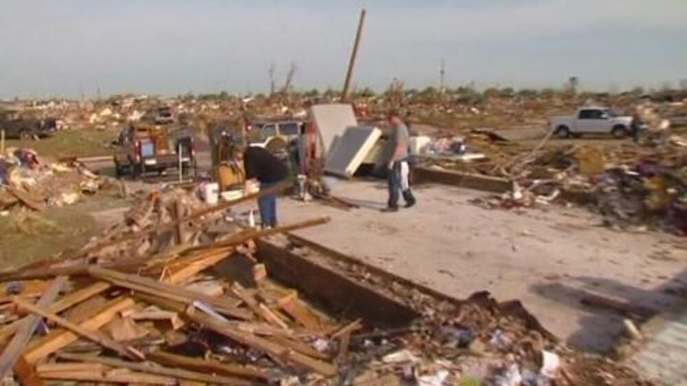 Video: Residents comb through tornado debris