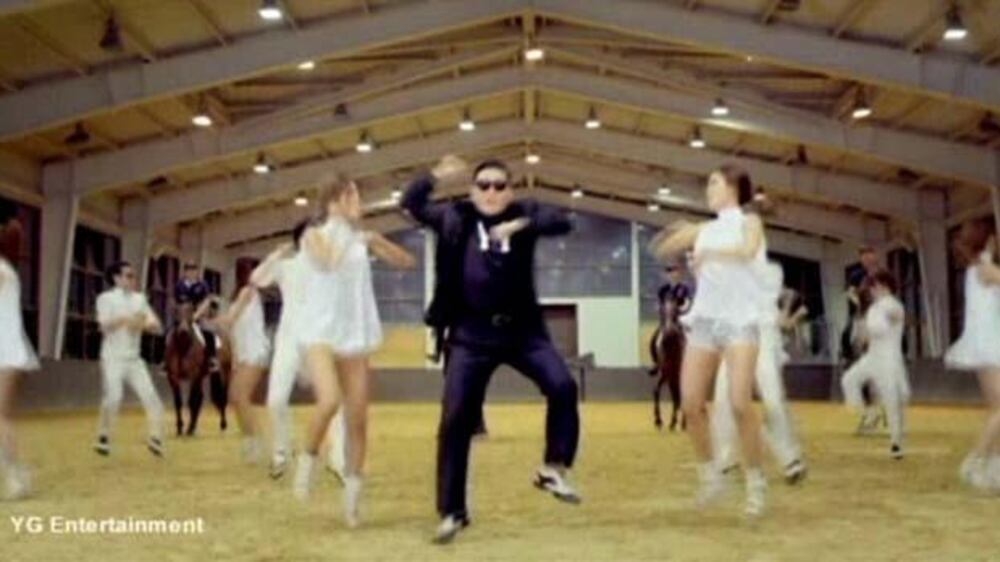 Video: Gangnam Style hits 1 billion views; Joan Baez preforms in Prague