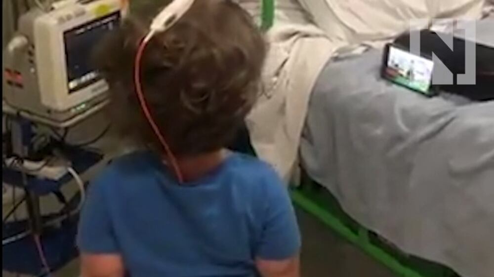 7-year-old works out beside hospital bed 24 hours after brain surgery