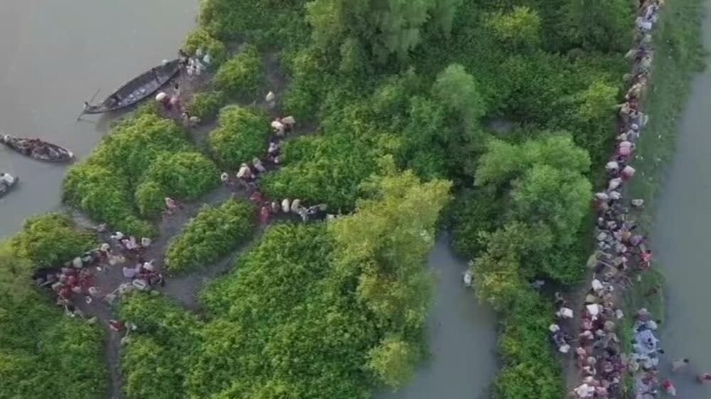 Drone footage shows thousands of Rohingya refugees entering Bangladesh over Naf river