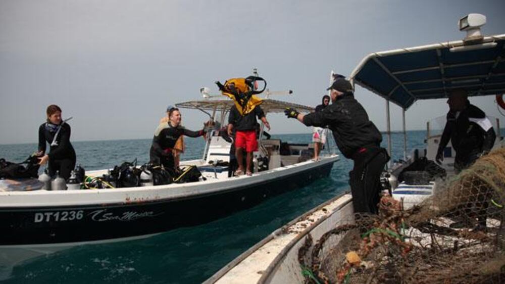 Video: Diving for debris