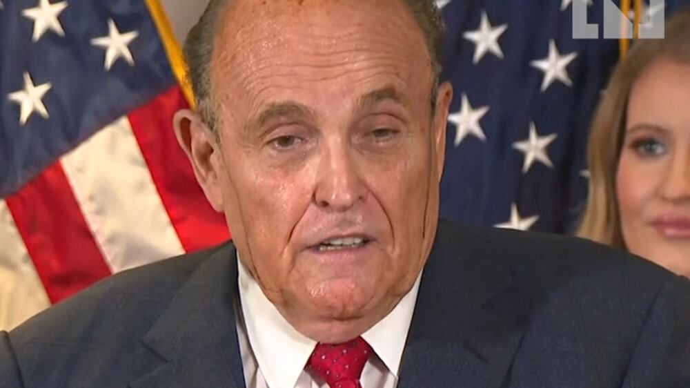 Rudy Giuliani sweats hair dye at election press update