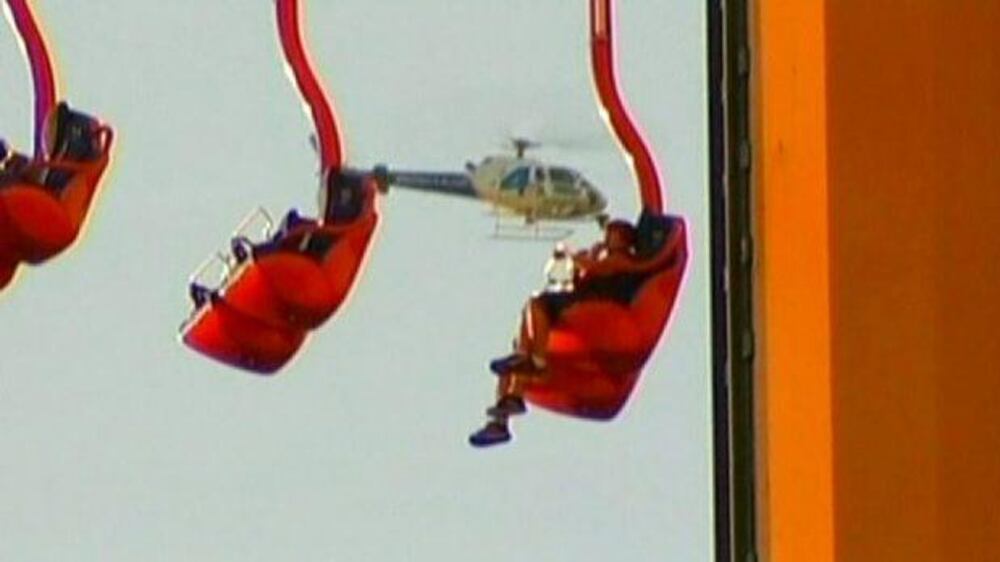 Video: Theme park riders left dangling at 300ft