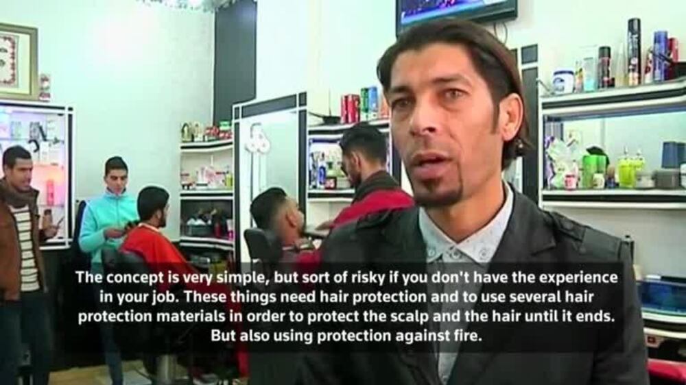 Gazan barber offers flaming hot new style - video