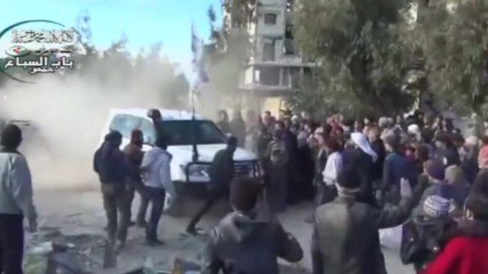 Video: As UN evacuates Homs, authorities detain some residents for questioning