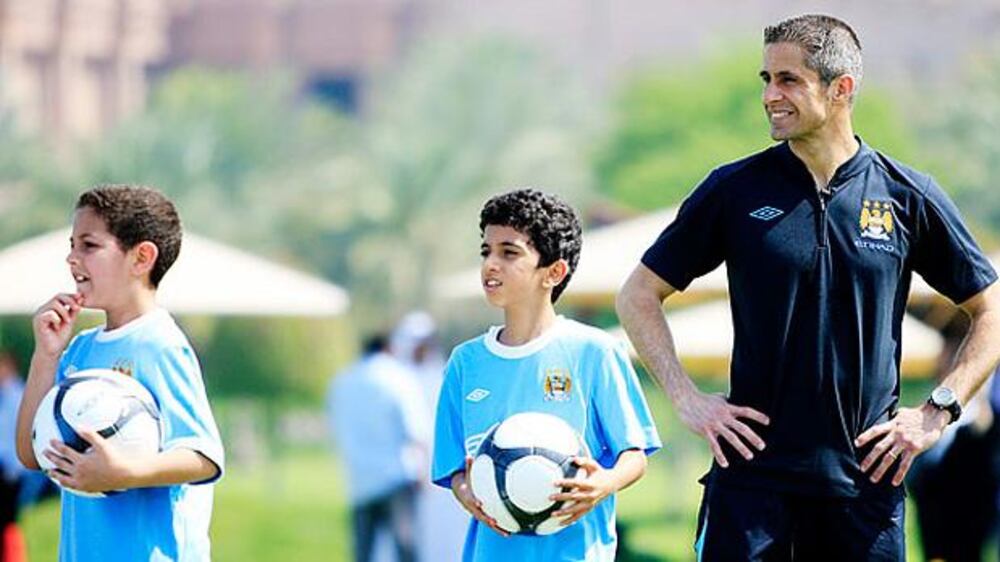 Man City players coach youths at football camp