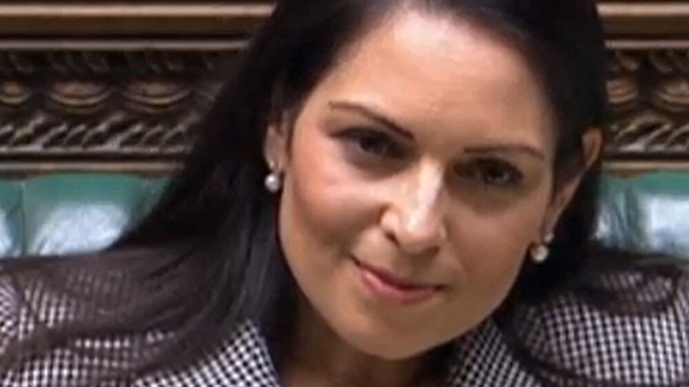 A video grab from footage broadcast by the UK Parliament's Parliamentary Recording Unit (PRU) shows Britain's Home Secretary Priti Patel gesturing as she gives a statement concerning the government's plan to send migrants and asylum seekers who cross the Channel to Rwanda, in the House of Commons, in London, on June 15, 2022.  - Britain vowed Wednesday it would pursue its controversial policy to deport asylum seekers to Rwanda after a first flight was cancelled following a legal ruling, in an embarrassing blow to Prime Minister Boris Johnson's government.  The number of those due to be put on the flight on Tuesday had dwindled from an original 130 to seven and finally none after a last-minute order by the European Court of Human Rights (ECHR).  (Photo by PRU  /  AFP)  /  RESTRICTED TO EDITORIAL USE - MANDATORY CREDIT "AFP PHOTO  /  PRU " - NO MARKETING - NO ADVERTISING CAMPAIGNS - DISTRIBUTED AS A SERVICE TO CLIENTS