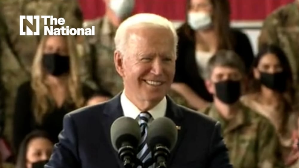 Biden jokes with US forces: 'Please, at ease. I keep forgetting I'm president'