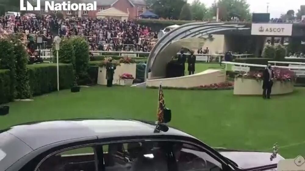Crowd cheers Queen Elizabeth II as she arrives at Ascot Racecourse