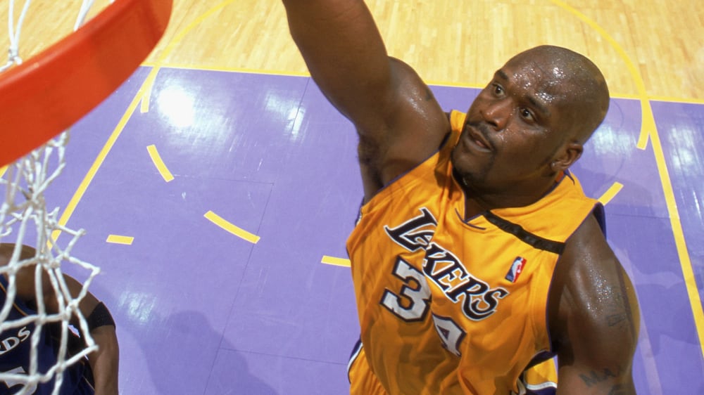 LOS ANGELES - MARCH 28:  Shaquille O'Neal #34 of the Los Angeles Lakers takes the ball up during the game against the Washington Wizards at Staples Center on March 28, 2003 in Los Angeles, California. The Lakers defeated the Wizards 108-94.  NOTE TO USER: User expressly acknowledges and agrees that, by downloading and/or using this Photograph, User is consenting to the terms and conditions of the Getty Images License Agreement. Mandatory copyright notice:  Copyright 2003 NBAE (Photo by: Andrew D. Bernstein/NBAE via Getty Images)