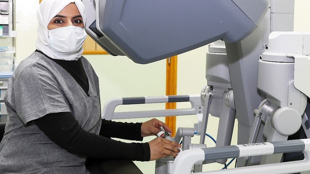 Gynaecologist Dr Muna Kishwai, first female Emirati doctor performed the robotic surgery at the Al Qassimi hospital in Sharjah. She is showing the Robotic surgical system in the OT. Pawan Singh / The National