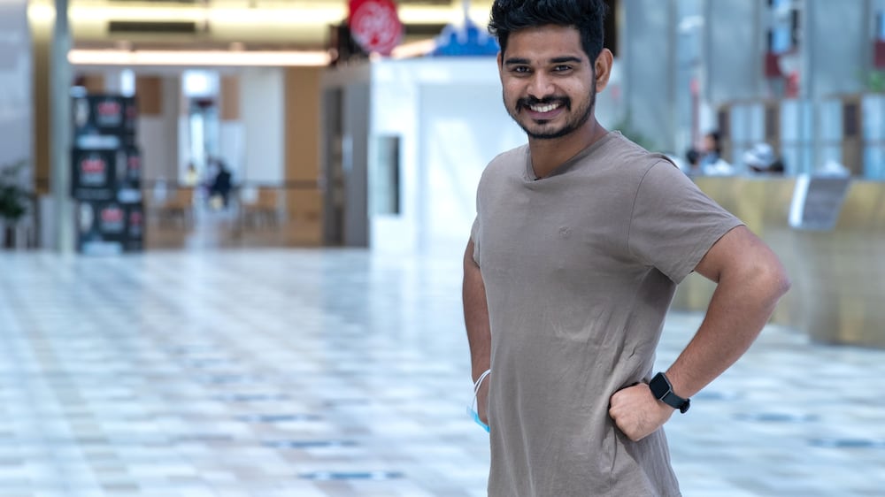 Shopkeeper jogs in Abu Dhabi Cruise Terminal during breaks to stay fit