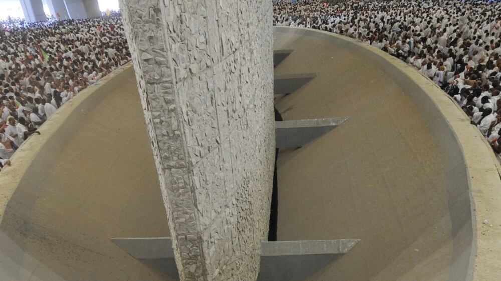 Hajj pilgrims perform the stoning ritual at Jamarat