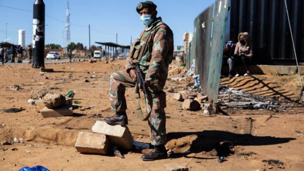 Thousands of South African soldiers sent to prevent looting as unrest continues