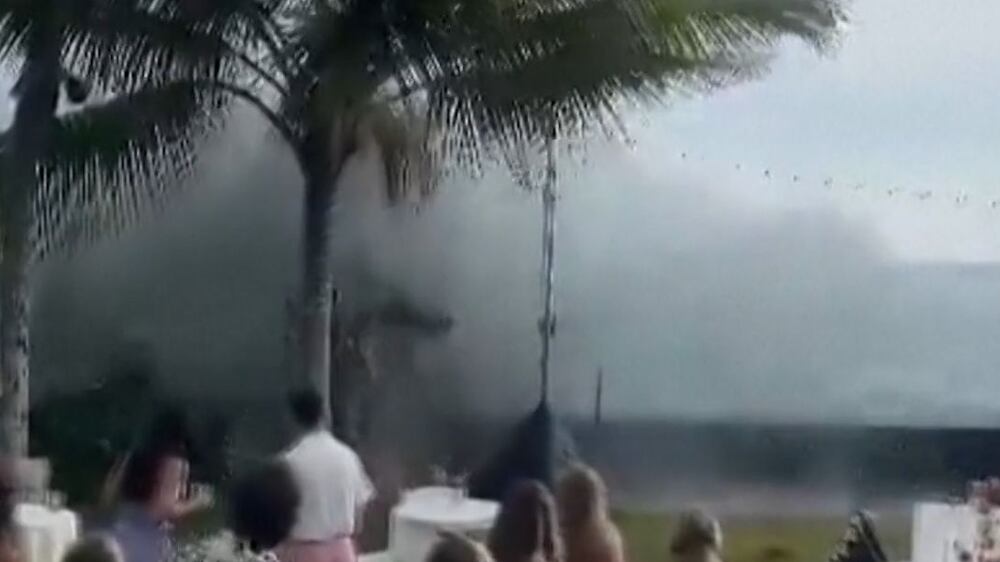 Massive waves crash on Hawaii wedding