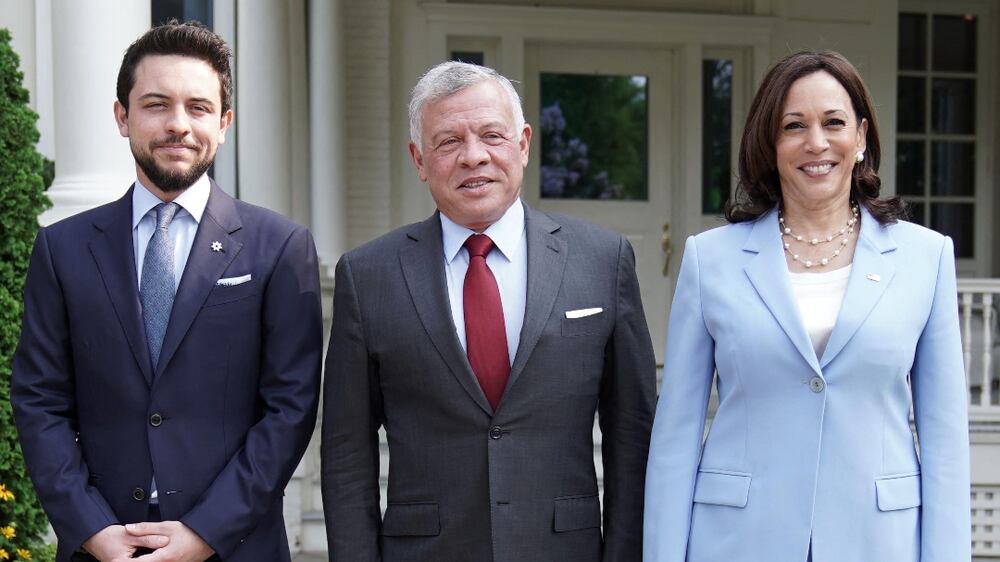 A handout picture released by the Jordanian Royal Palace on July 20, 2021, shows Jordanian King Abdullah II (C) accompanied by Crown Prince Hussein bin Abdullah (L), receiving US Vice President Kamala Harris, in the capital Amman.  (Photo by Yousef ALLAN  /  Jordanian Royal Palace  /  AFP)  /  RESTRICTED TO EDITORIAL USE - MANDATORY CREDIT "AFP PHOTO  /  JORDANIAN ROYAL PALACE  /  YOUSEF ALLAN" - NO MARKETING NO ADVERTISING CAMPAIGNS - DISTRIBUTED AS A SERVICE TO CLIENTS