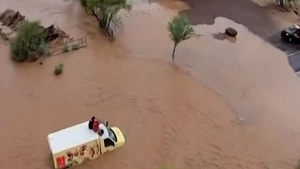 Maricopa County Sheriff's Office aviation unit rescued a driver and his companion after their vehicle got stuck in floodwaters on in Arizona, United States.