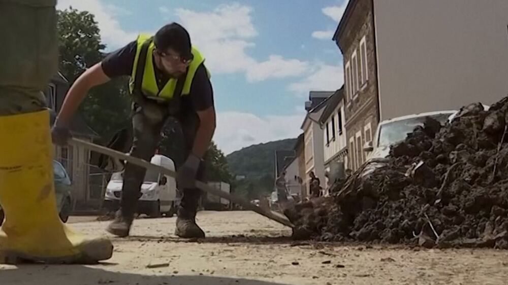 'Like back in Syria': migrant volunteers clear up flood-hit Germany