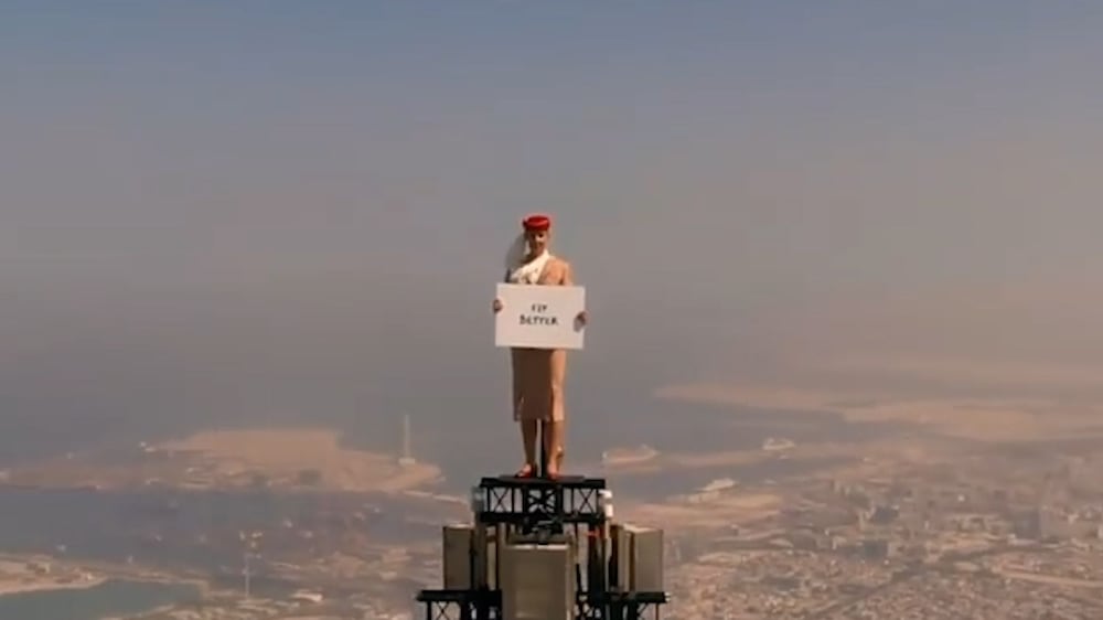 Emirates 'flight attendant' on top of the world to celebrate UK travel rules change