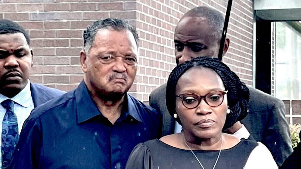Wanda Cooper-Jones and Marcus Arbery, the parents of Ahmaud Arbery, are flanked by Rev.  Jesse Jackson and Attorney Lee Merritt while addressing the media following the sentencing of Travis McMicheal in federal court in Brunswick, Ga.  on Monday, Aug.  8, 2022.  The white man who fatally shot Arbery after chasing the 25-year-old Black man in a Georgia neighborhood was sentenced Monday to life in prison for committing a federal hate crime.  (AP Photo/Lewis M.  Levine)