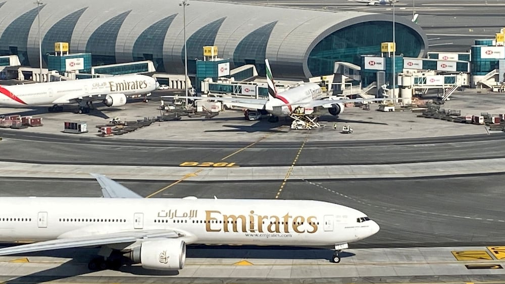 FILE PHOTO: Emirates airliners are seen on the tarmac in a general view of Dubai International Airport in Dubai, United Arab Emirates January 13, 2021.  Picture taken through a window.  REUTERS / Abdel Hadi Ramahi / File Photo