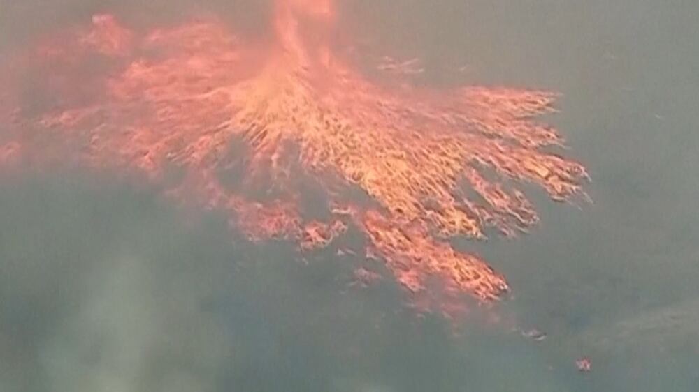 California bushfire creates 'smokenado' and 'firenado'