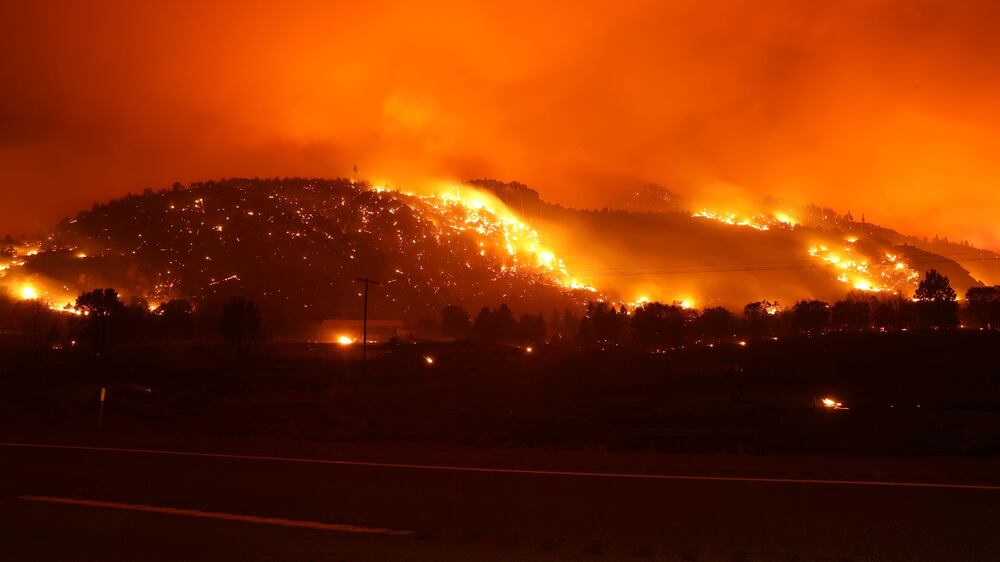 MILFORD, CALIFORNIA - AUGUST 17: The Dixie Fire burns in the hills on August 17, 2021 near Milford, California.  The Dixie Fire has burned over 604,000 acres, has destroyed over 1,000 homes and threatens thousands more.  The fire, the largest single fire in California state history, is 31 percent contained.    Justin Sullivan / Getty Images / AFP
