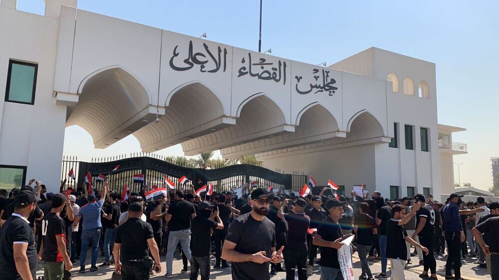 Supporters of Iraq's Shiite cleric Moqtada Al Sadr gather outside Supreme Judiciary Council building