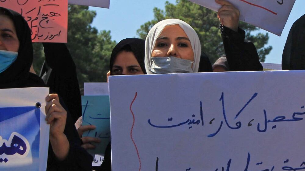 Afghan women stage protest urging country's new leaders to include women in the cabinet