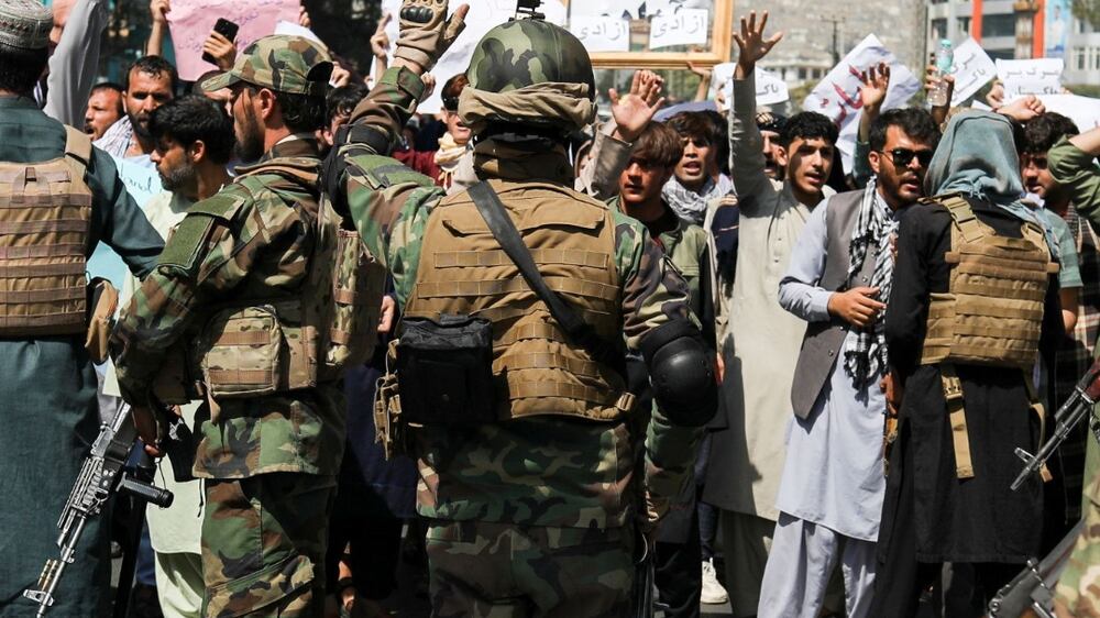 Protesters in Kabul run for cover as Taliban fire into the air